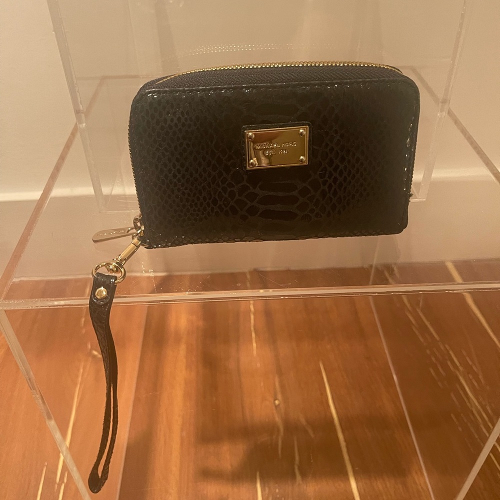 Michael Kors leather 6” wristlet wallet with strap. Excellent condition.